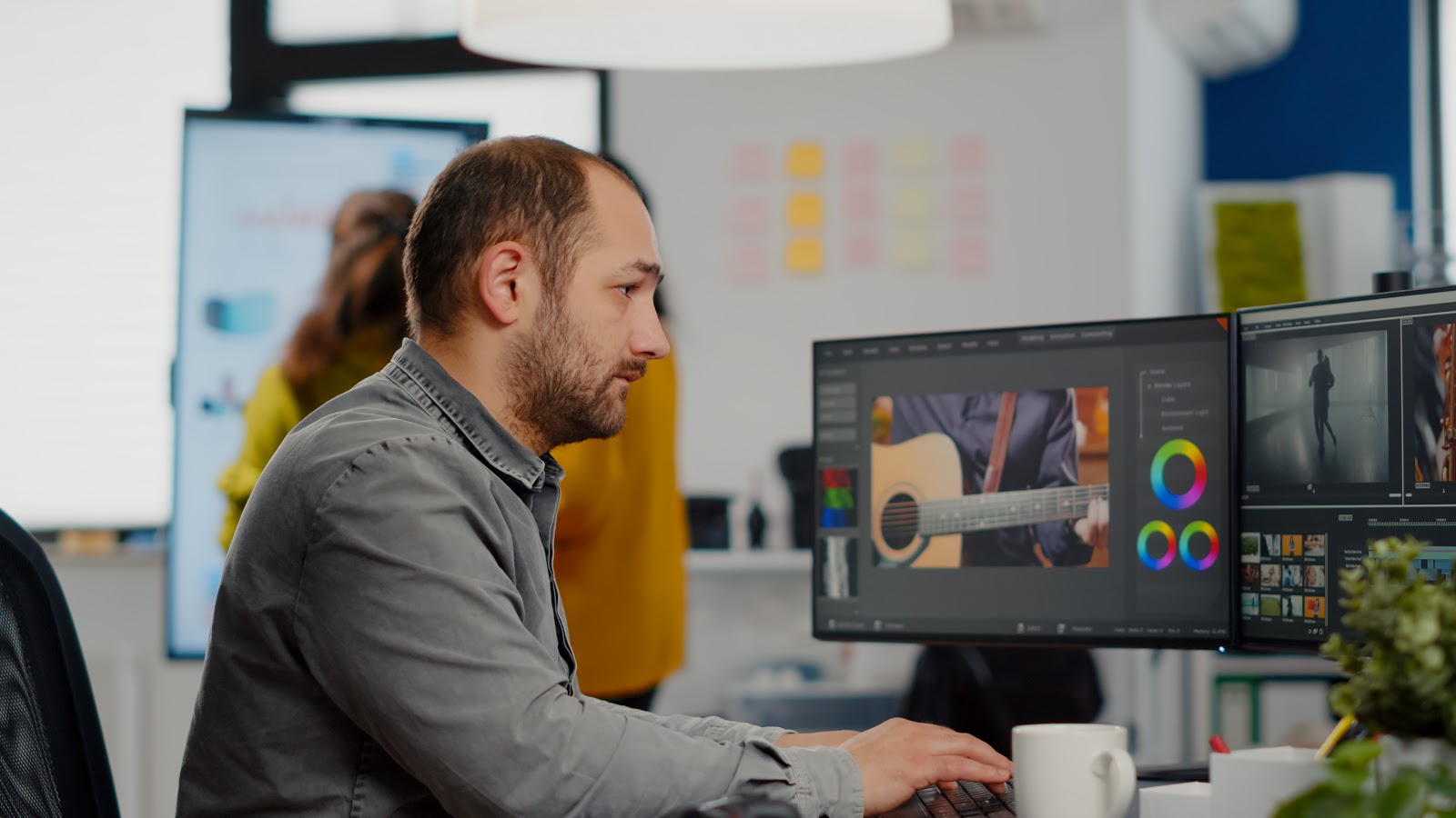 a man creating graphics on a computer