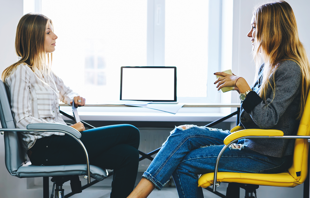 Image showing two women sitting at a table conducting a mock interview.