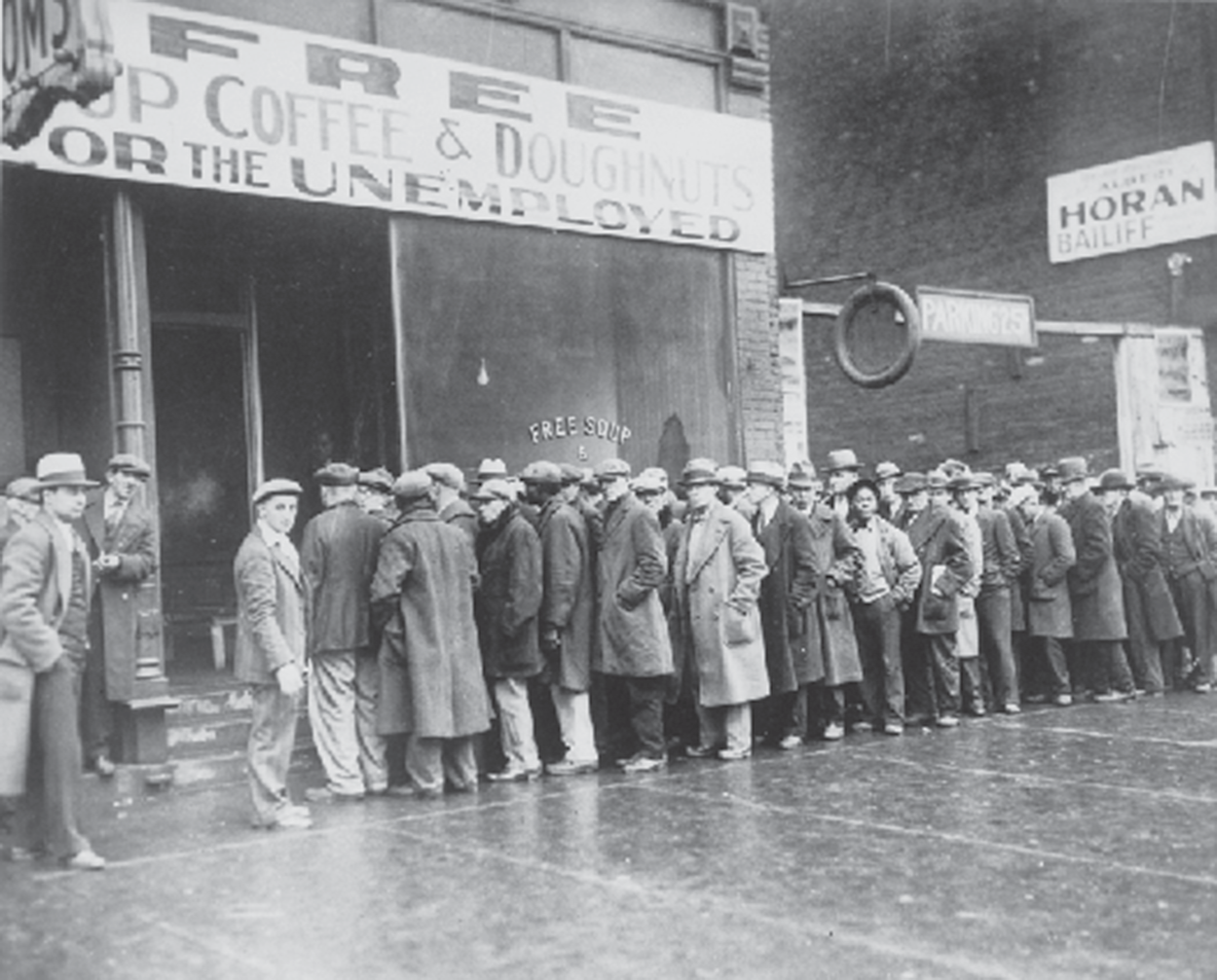 A line of people outside a store front.