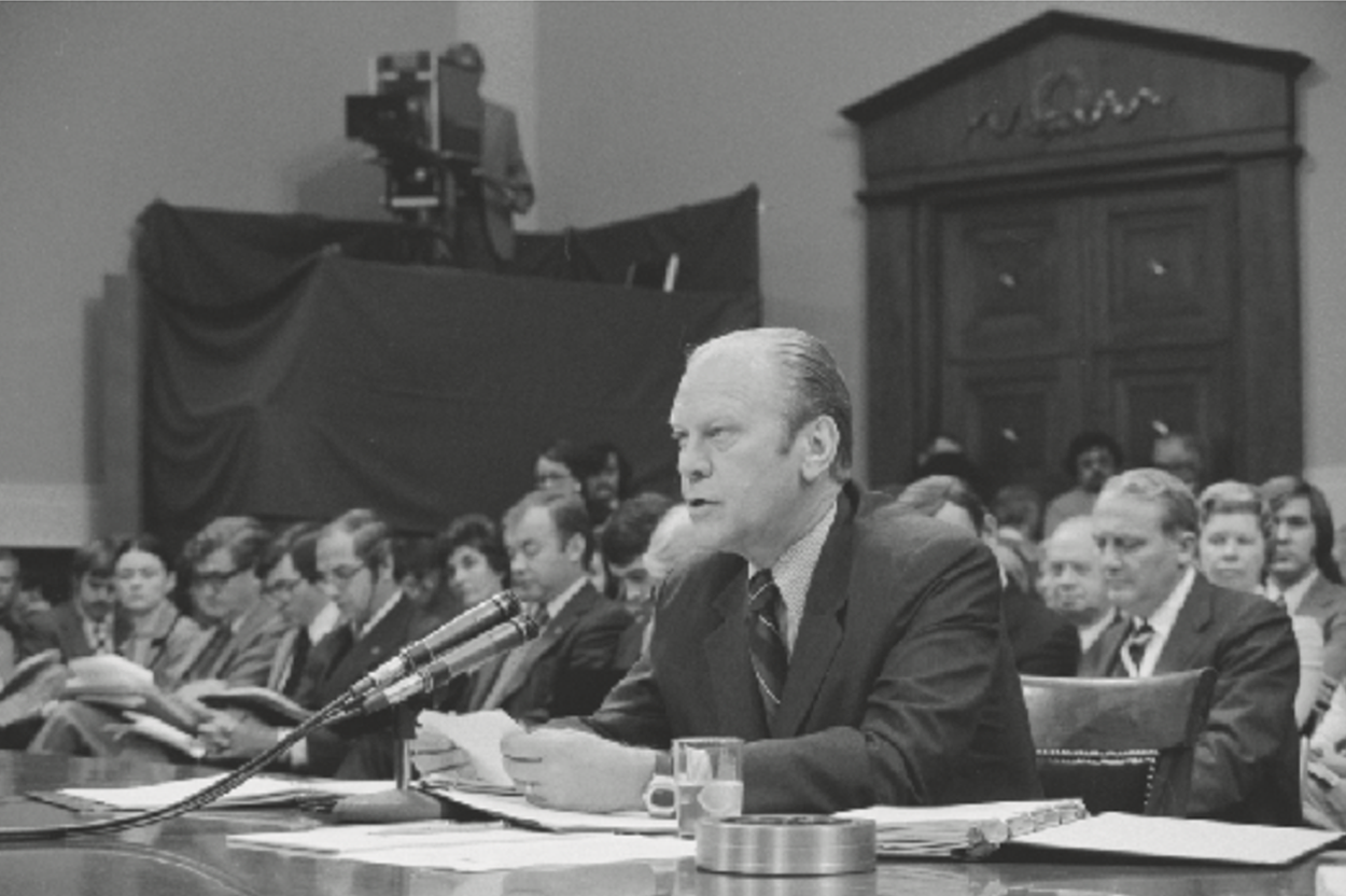 President Ford in front of microphone.
