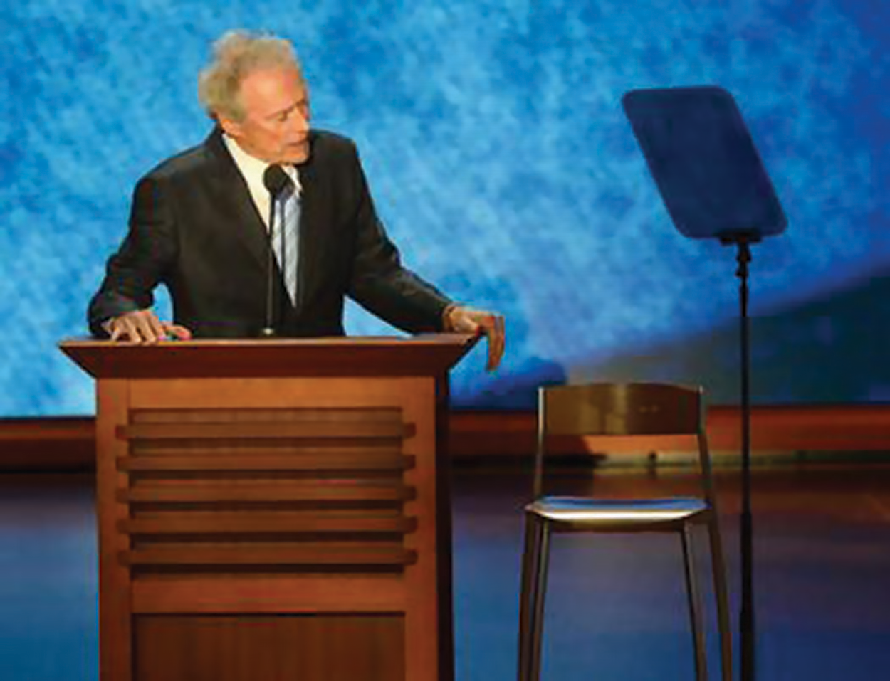 (Figure 5) In August 2012, Clint Eastwood—actor, director, and former mayor of Carmel-by-the-Sea, California—spoke at the Republican National Convention accompanied by an empty chair representing the Democratic incumbent president Barack Obama. Clint Eastwood lecturing from a podium.