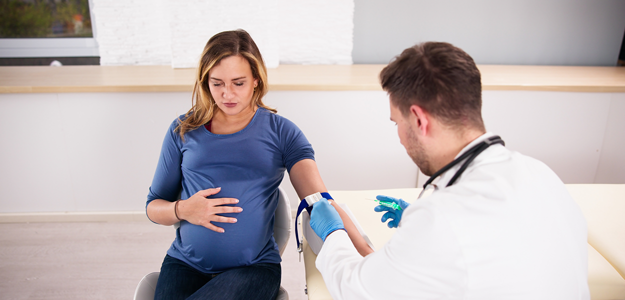 Image of a pregnant woman getting testing done.