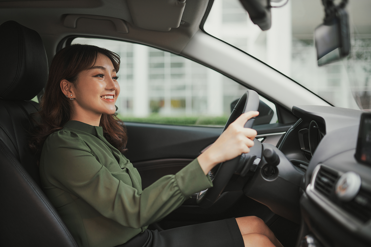 An image of a woman driving a car.