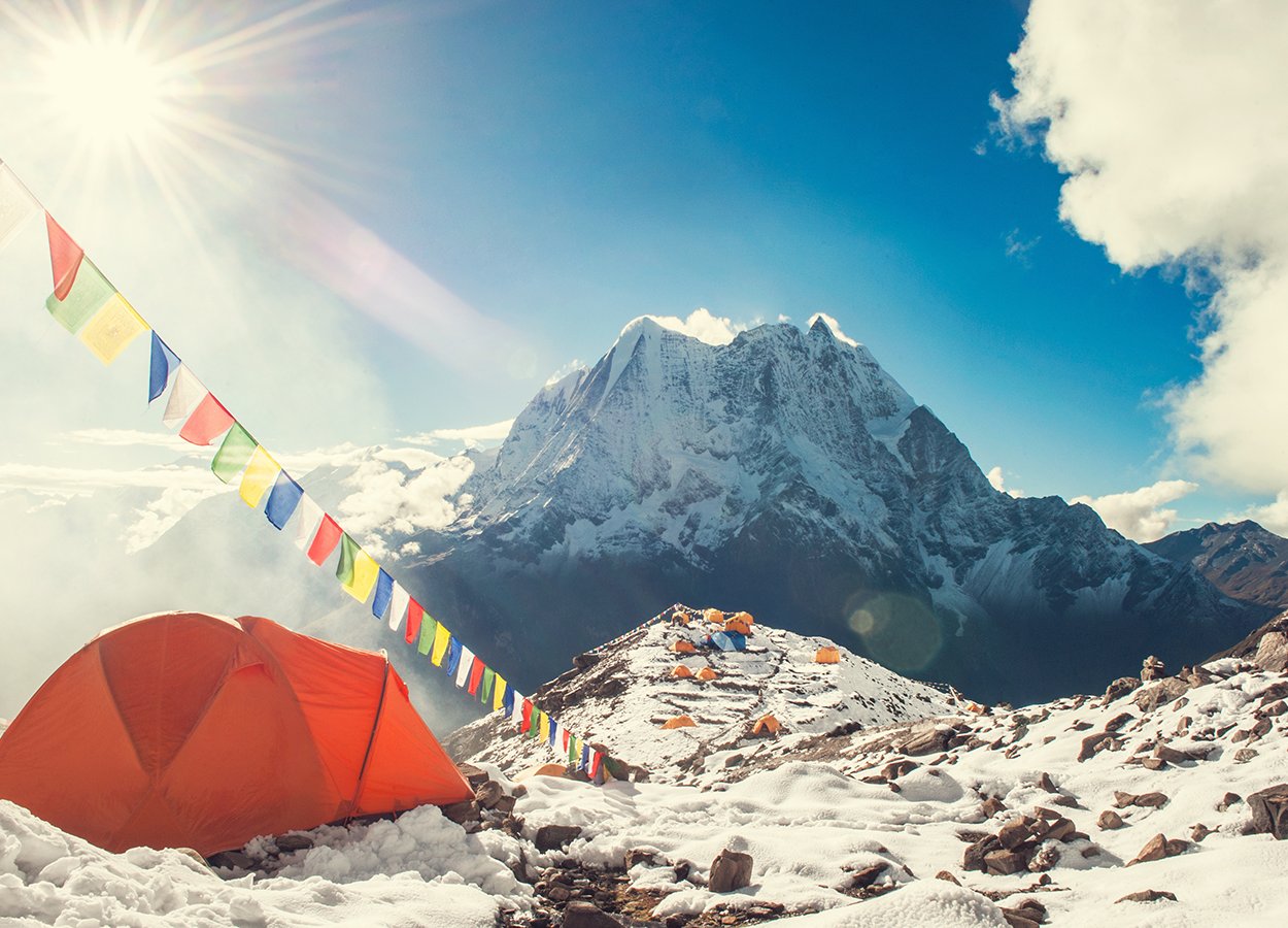 Tents set up on the south base camp in Nepal. The weather is cold and ice and snow are present everywhere.