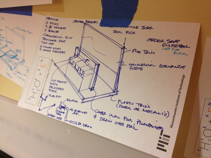 A photograph of a drawing of a diagram in blue ink on paper.