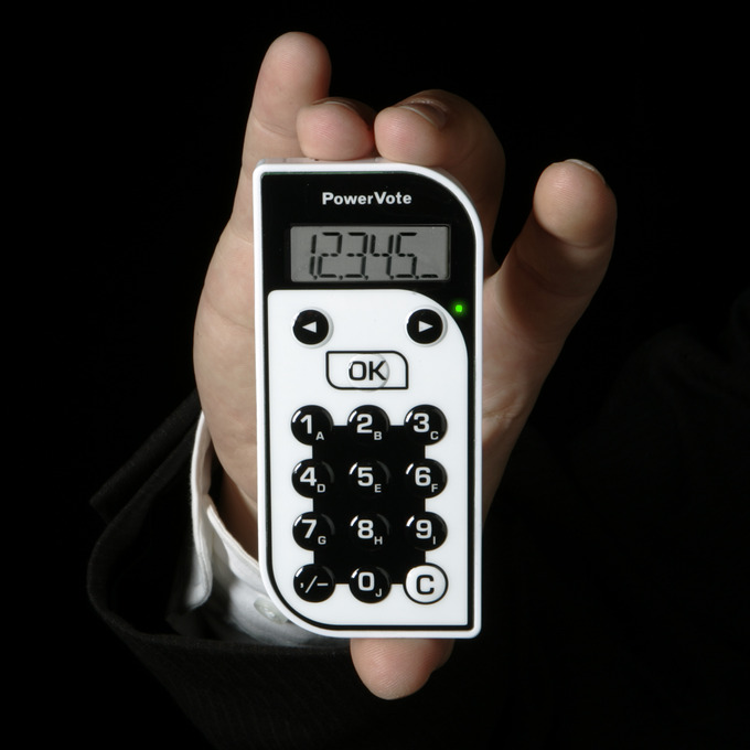 A small handheld device is shown that has numerical buttons and a digital screen.