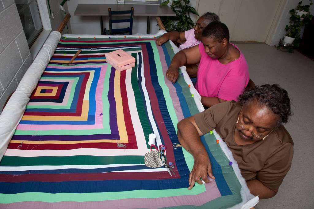 quilt has large bands of color in a repeating square pattern