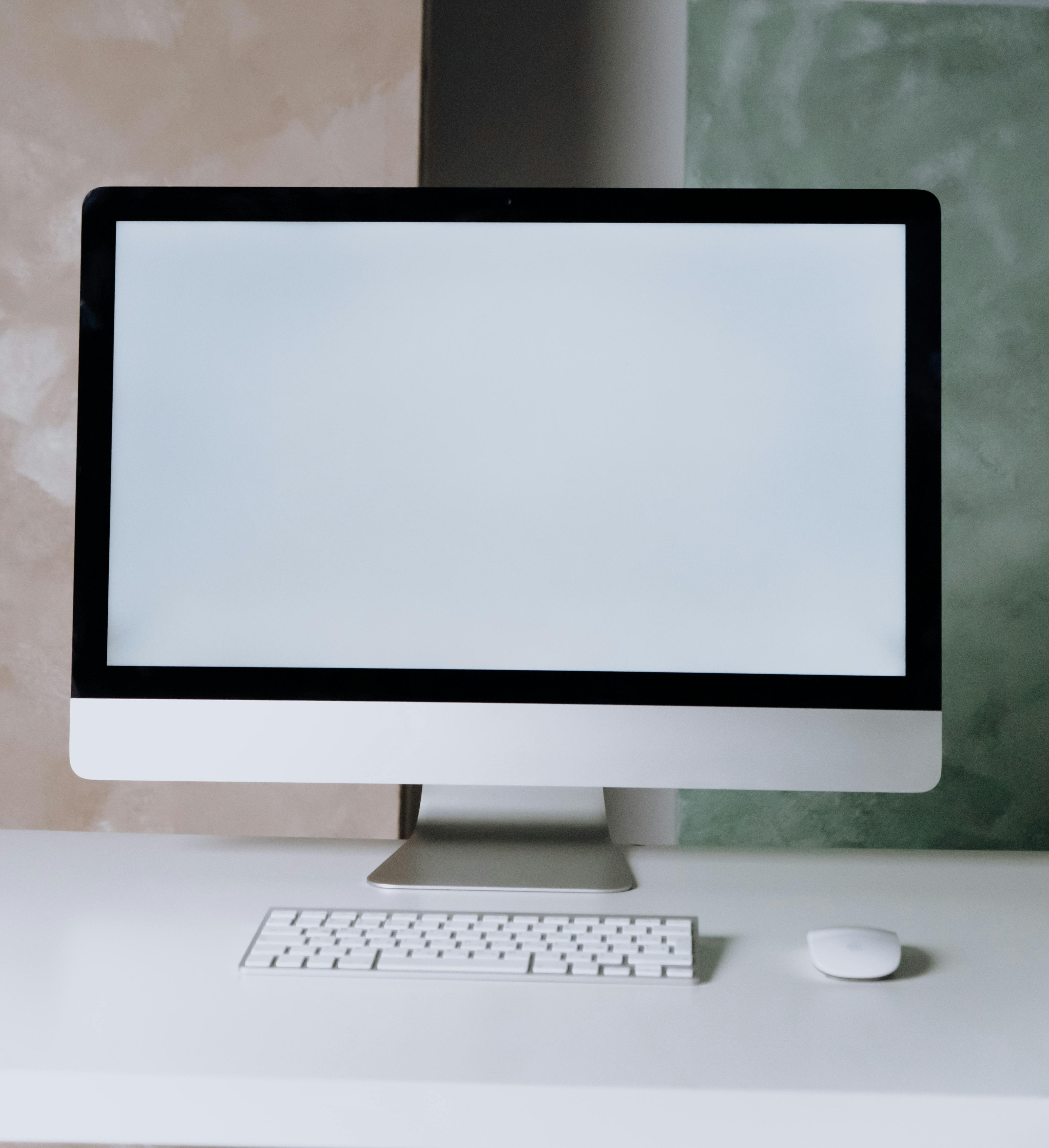 the monitor, mouse, and keyboard belonging to a desktop computer
