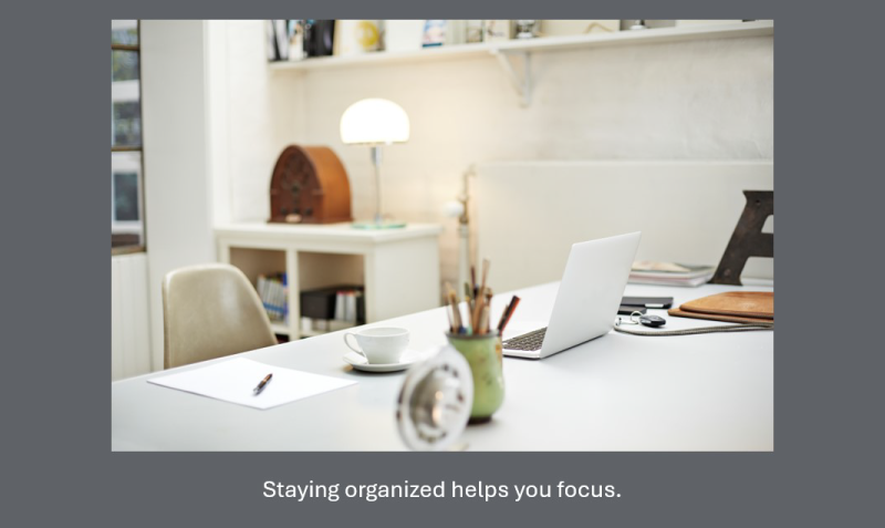 Image slide showing a center-aligned photo of an organized workspace with a caption below.